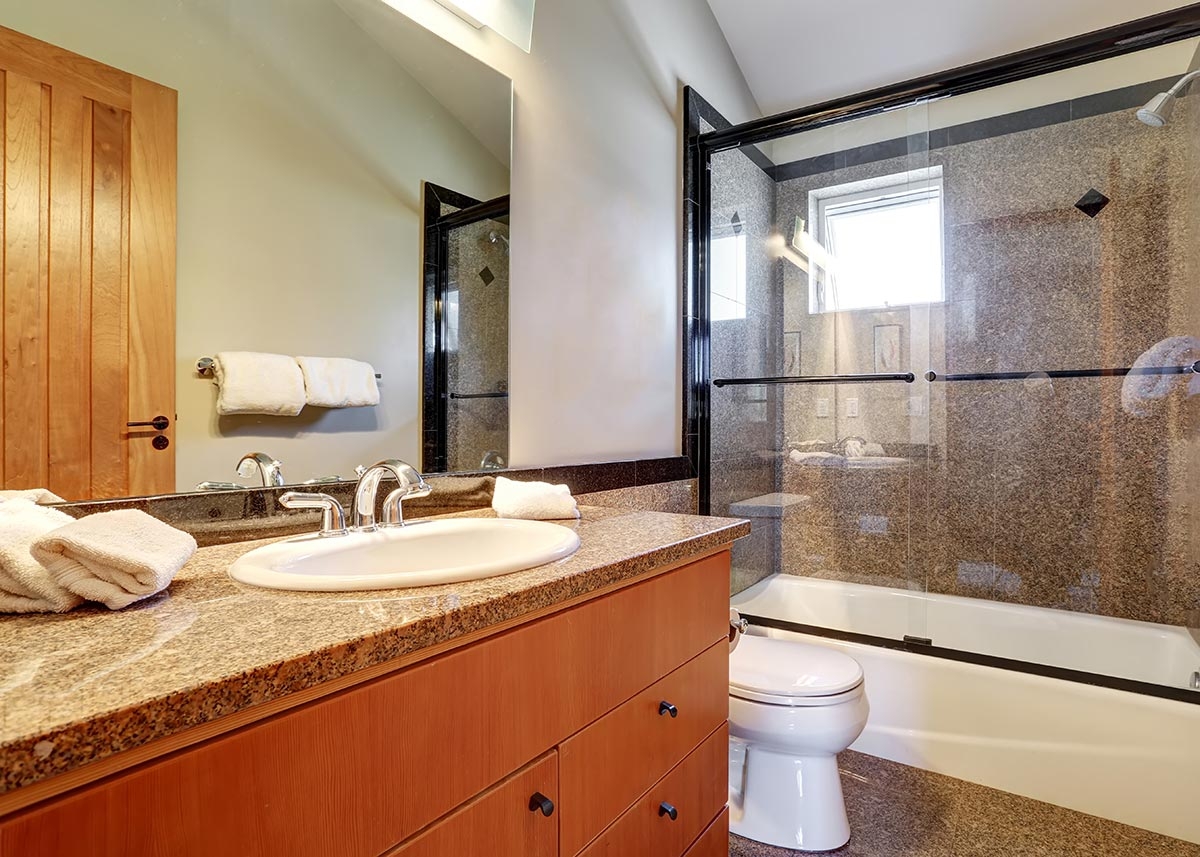 Bathroom granite countertop and glass shower remodel
